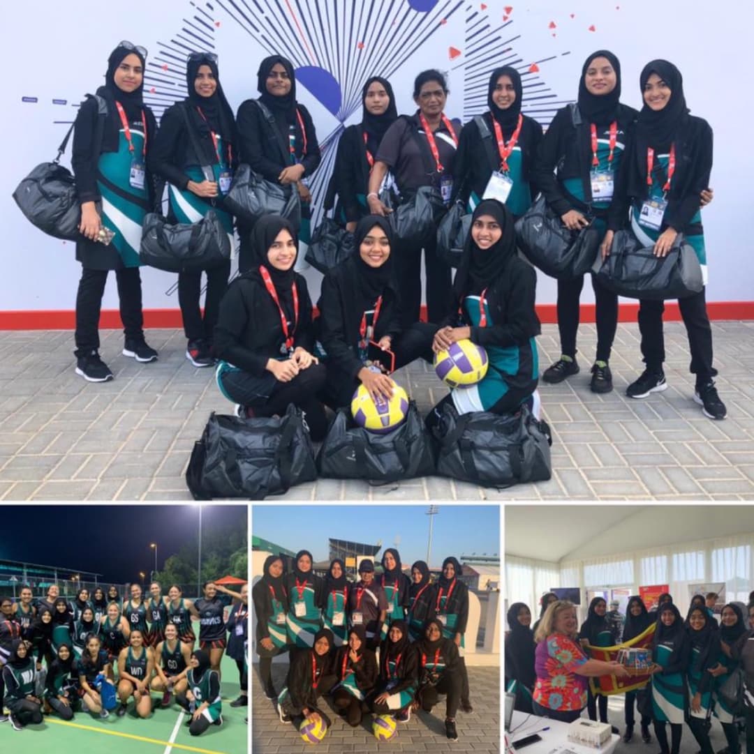 IIOGA netball team with trophies and gear bags